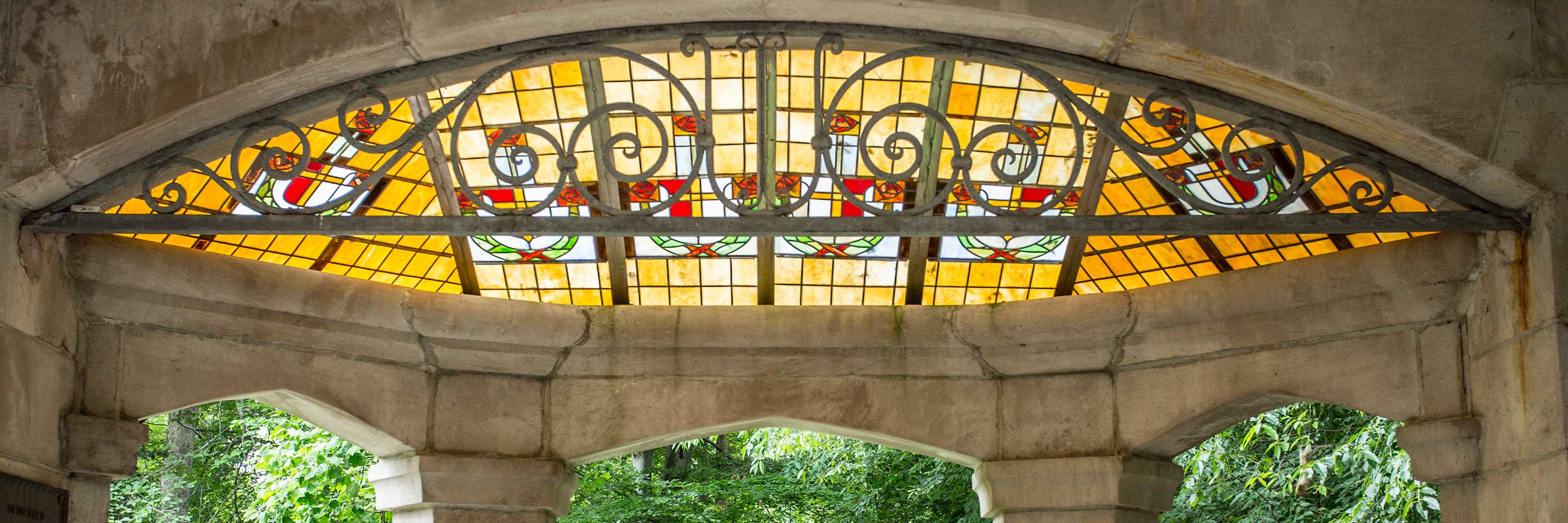 A picture of the stained glass in the Wells House gazebo, which includes the IU trident.