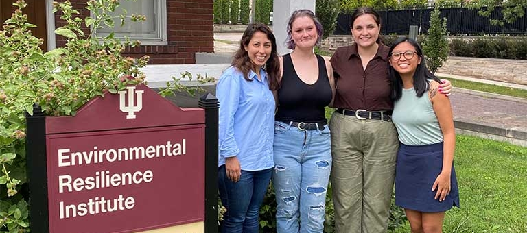 (From left) Homa Taheri and other McKinney Climate Fellows pose in front of the Environmental Resilience Institute.