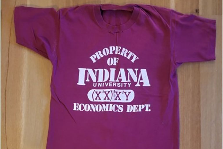 A photo of a t-shirt, with "Property of Indiana University Economics Dept." written on it.