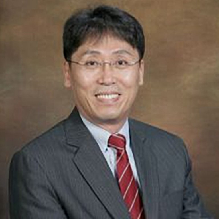 Joon Park, who wears a gray suit and red tie.