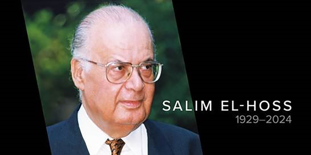 A headshot of the late Salim El-Hoss, who wears a dark blue suit and white dress shirt.